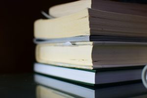 Pile of books with differing quality print